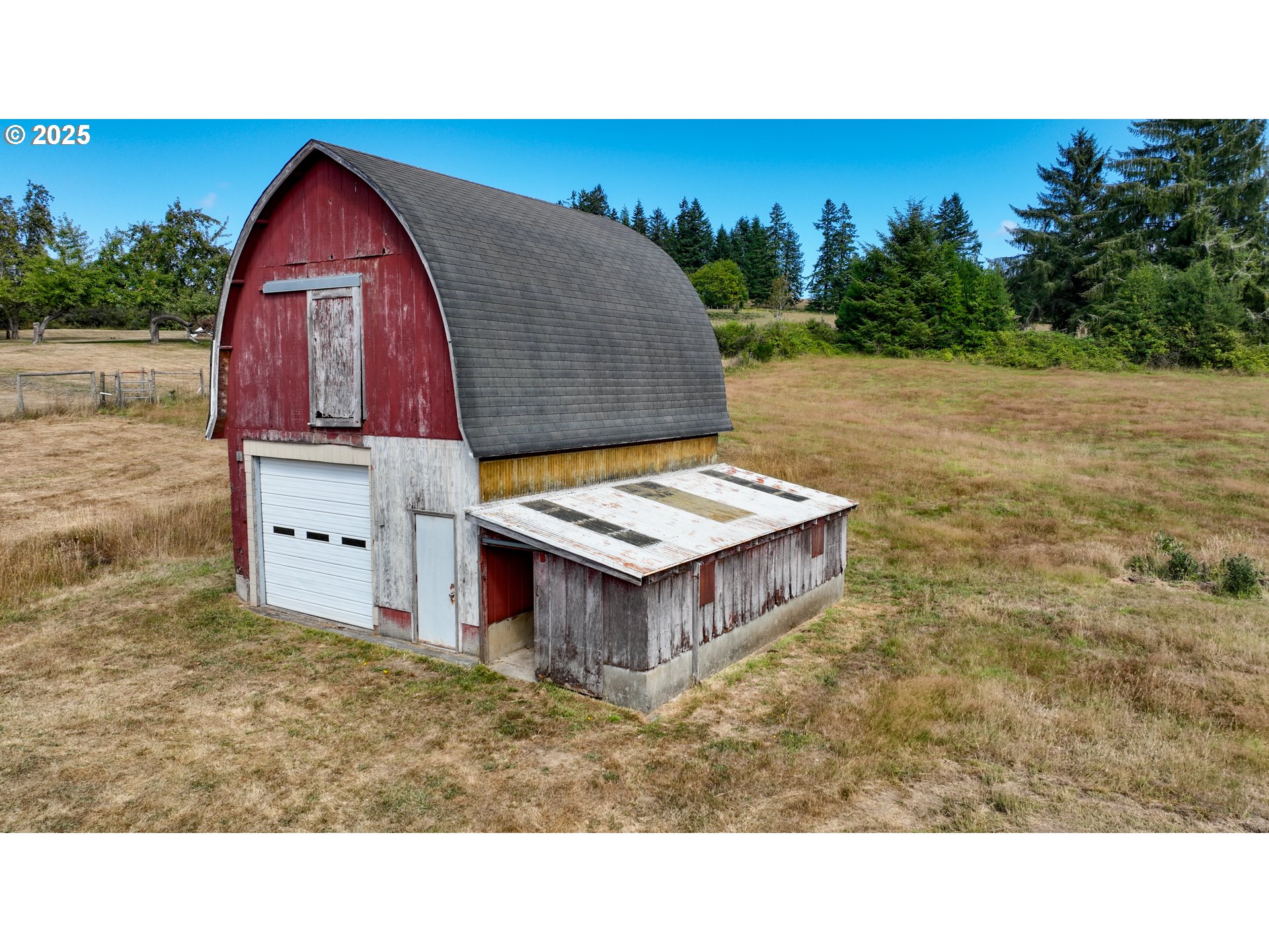 92693 T T Larson Road Astoria, OR 97103 - Photo 35 of 40 a aerial view of a house with swimming pool and large trees