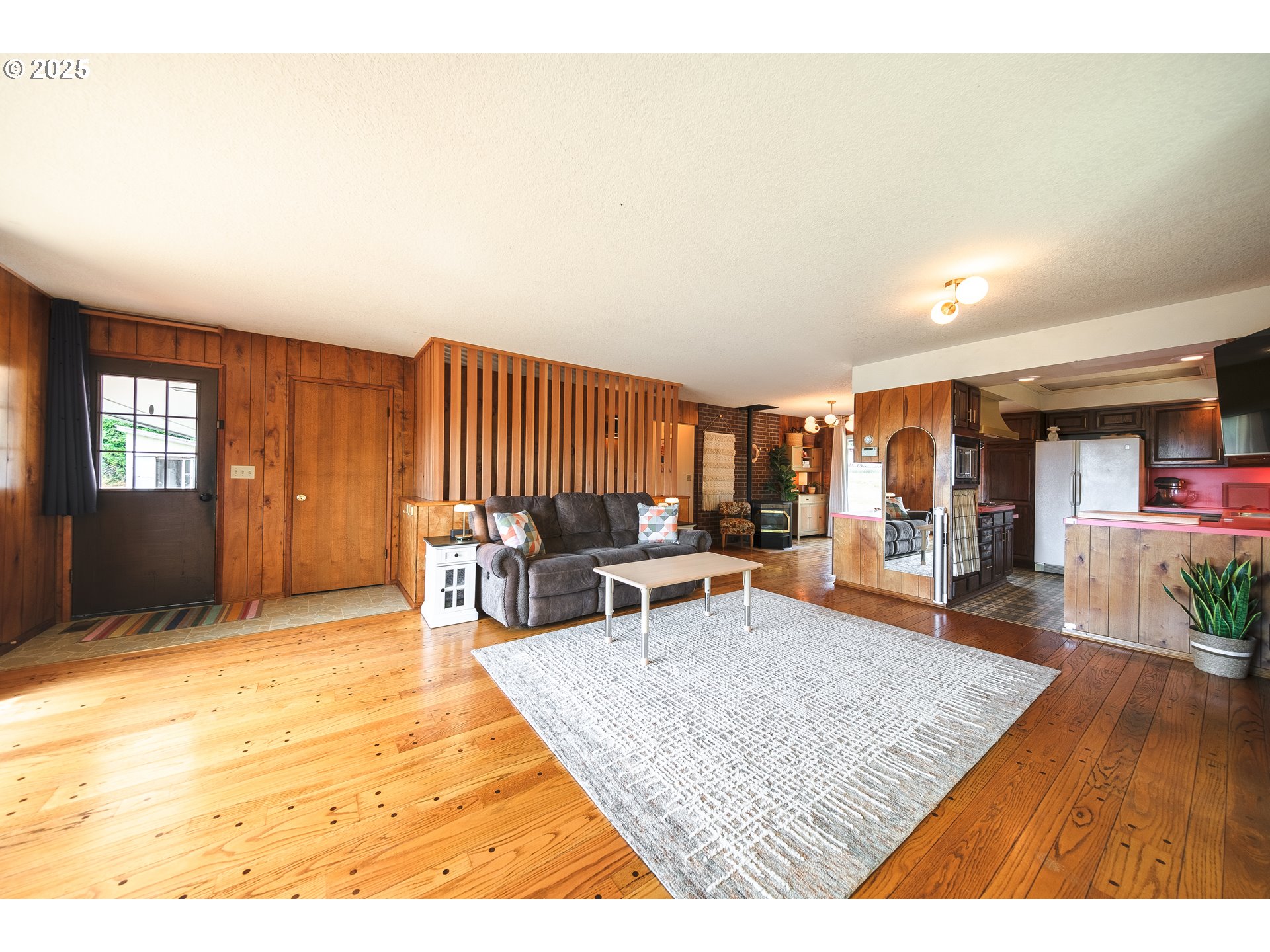 92693 T T Larson Road Astoria, OR 97103 - Photo 5 of 40 a living room with furniture and wooden floor