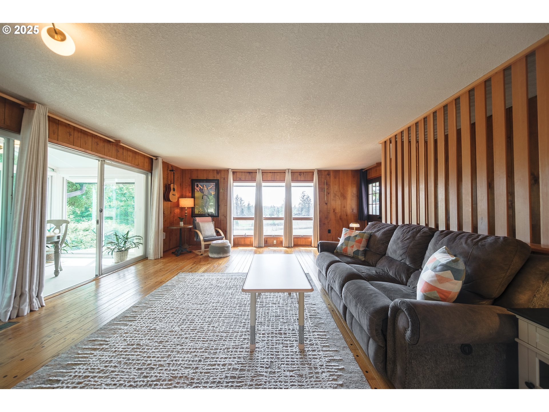 92693 T T Larson Road Astoria, OR 97103 - Photo 8 of 40 a living room with furniture and a large window