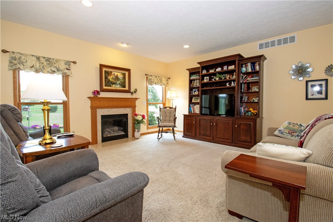 4281 Heyl Road Wooster, OH 44691 - Photo 2 of 32 Living room featuring a fireplace and light carpet