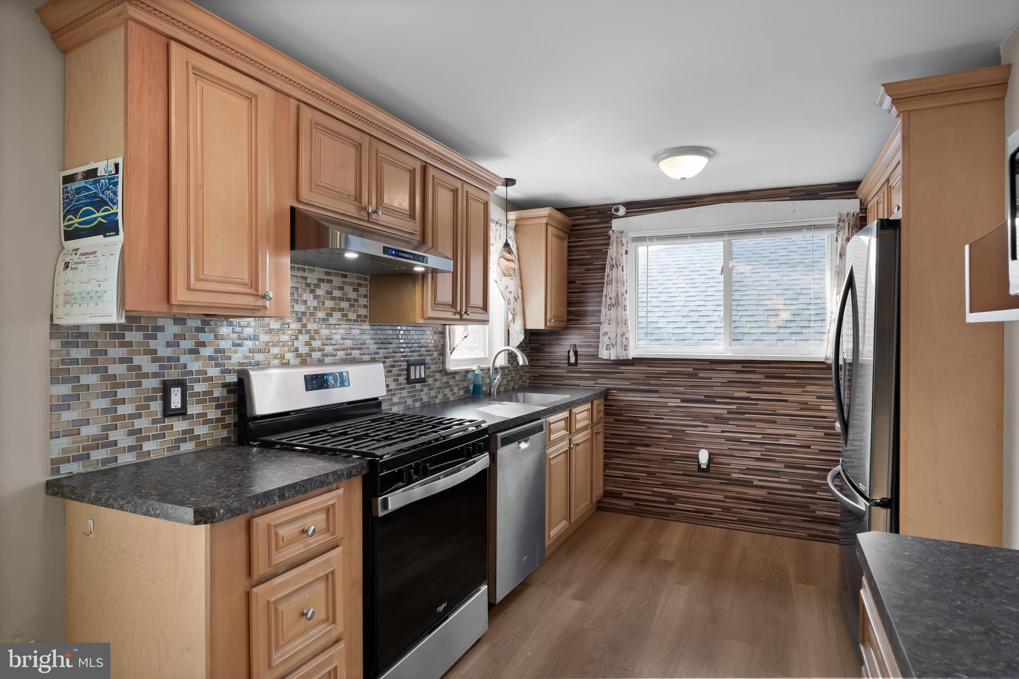 116 Fairmount Avenue Voorhees, NJ 08043 - Photo 13 of 37 a kitchen with stainless steel appliances granite countertop a stove a sink and a white cabinets