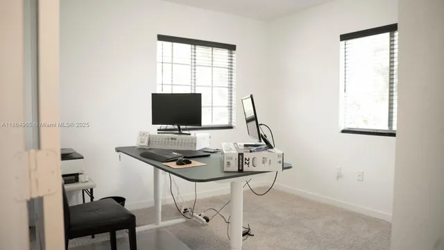 an empty room with a bed and a window