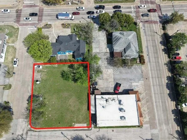 an aerial view of residential house with outdoor space and swimming pool