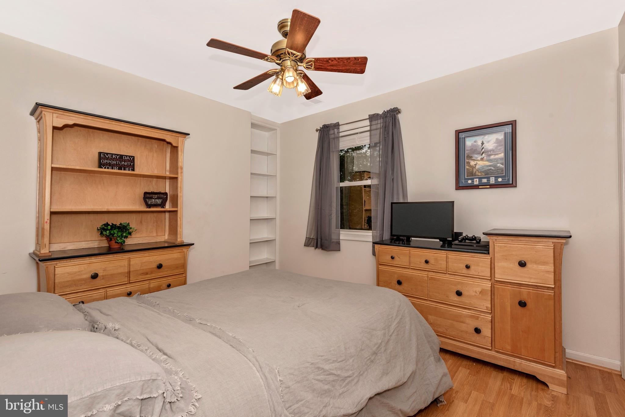 3522 Hooper Road New Windsor, MD 21776 - Photo 21 of 43 a bedroom with a bed and a flat tv screen on dresser