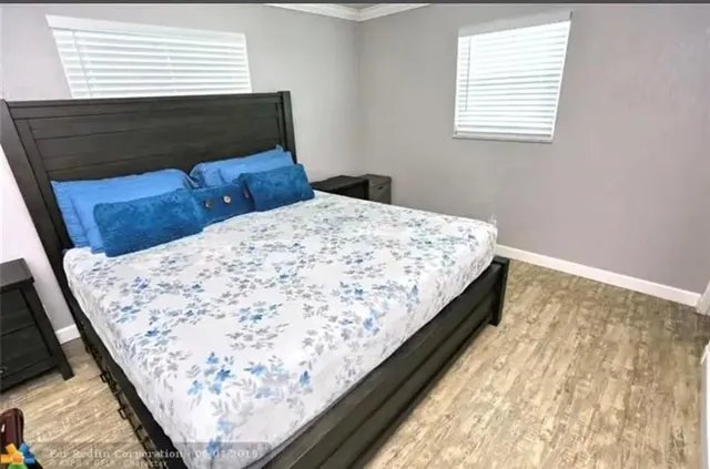 a bathroom with a sink a toilet a mirror and vanity