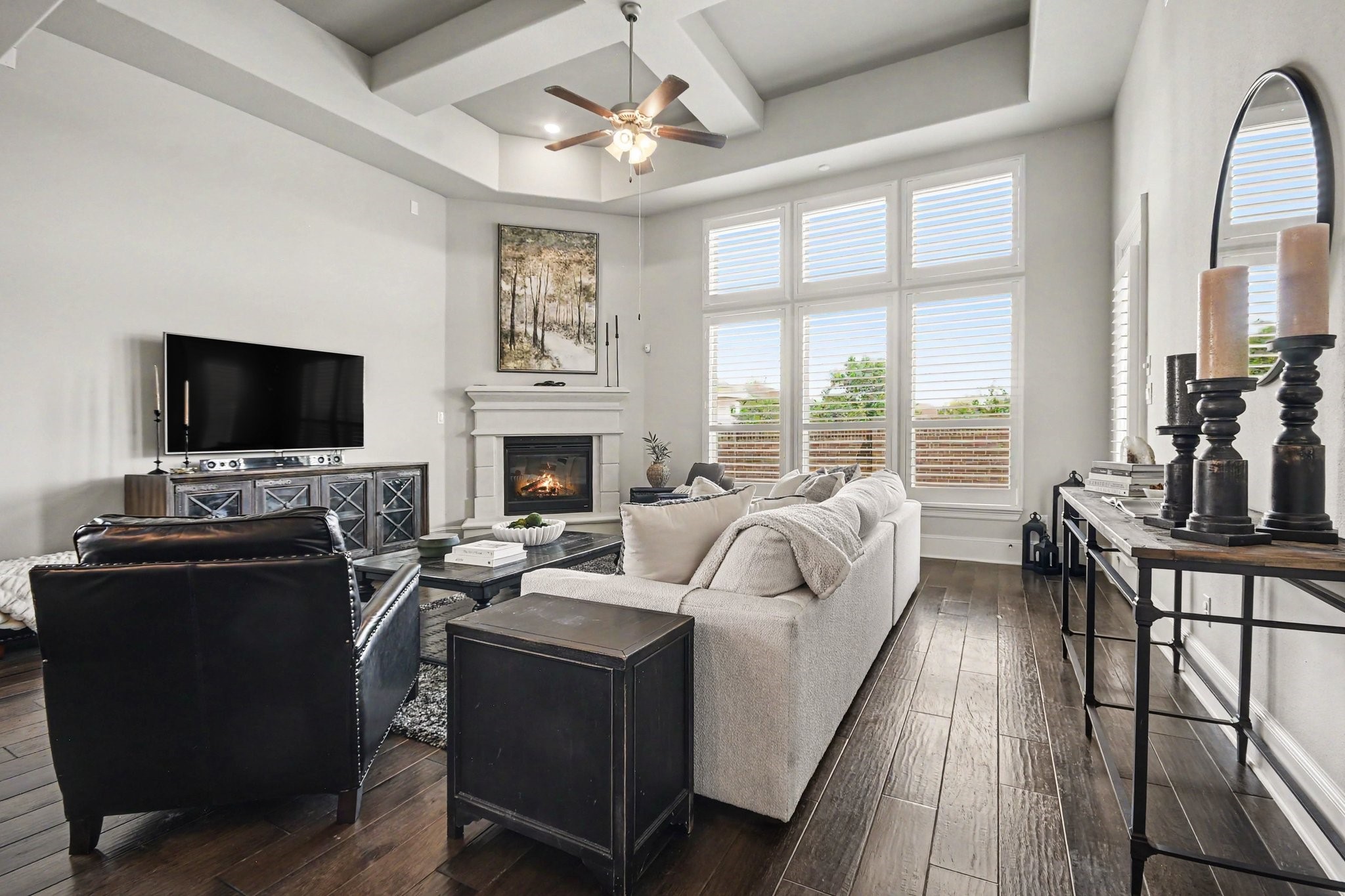 641 Kickapoo Court Webster, TX 77598 - Photo 17 of 39 Spacious living room featuring a stunning fireplace and natural lighting.