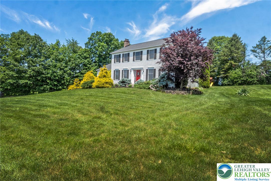 9461 Red Road Kempton, PA 19529 - Photo 53 of 55 A classic colonial residence with an expansive verdant lawn and mature landscaping.