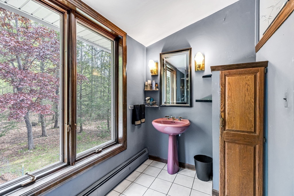 163 South Monson Road Hampden, MA 01036 - Photo 19 of 34 a bathroom with a toilet sink and mirror
