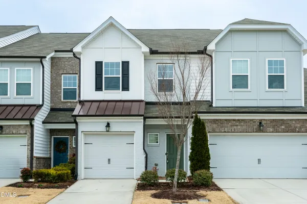 a front view of a house with a garage