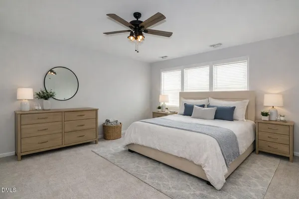 a bedroom with a bed and a dresser