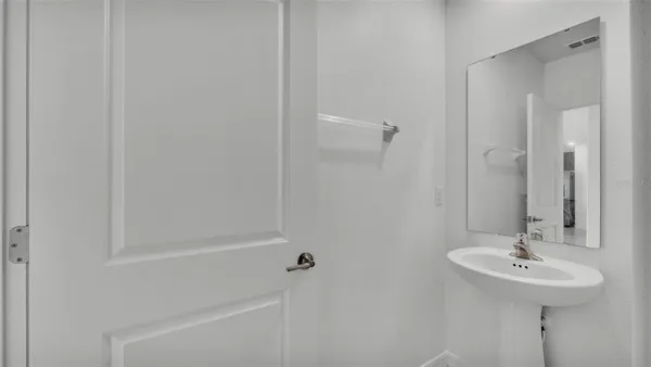 a bathroom with a sink a mirror and shower