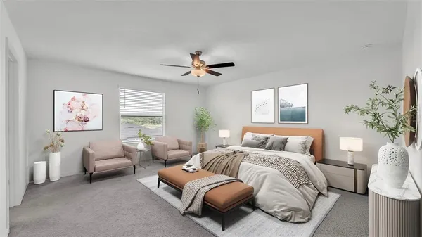 a bedroom with furniture and a large window