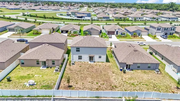 an aerial view of a house with a garden