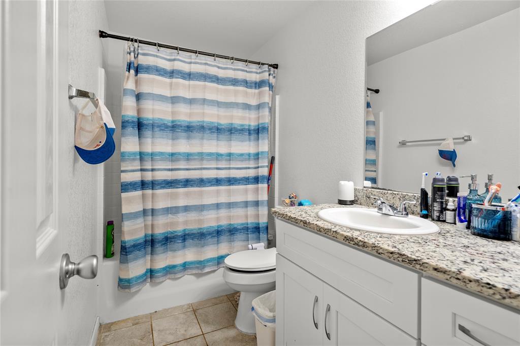 420 Whitney Court Rio Vista, TX 76093 - Photo 18 of 25 a bathroom with a sink toilet and shower