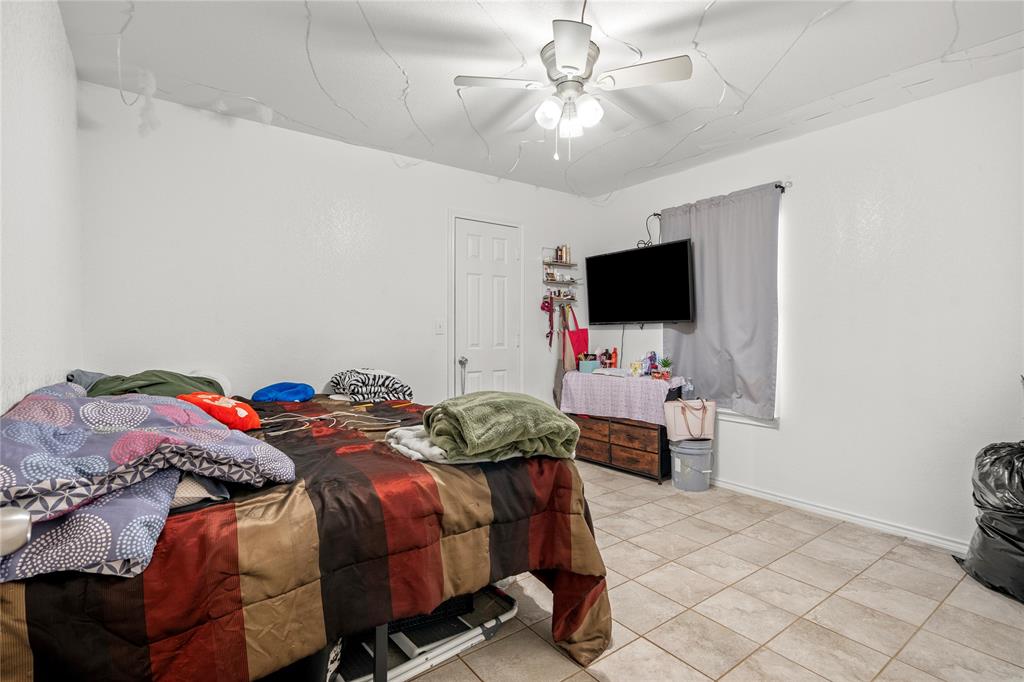 420 Whitney Court Rio Vista, TX 76093 - Photo 19 of 25 a bedroom with a bed and a flat screen tv