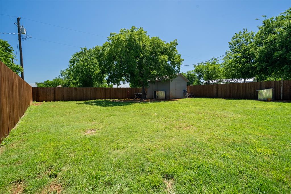 420 Whitney Court Rio Vista, TX 76093 - Photo 24 of 25 a swimming pool with outdoor seating and yard