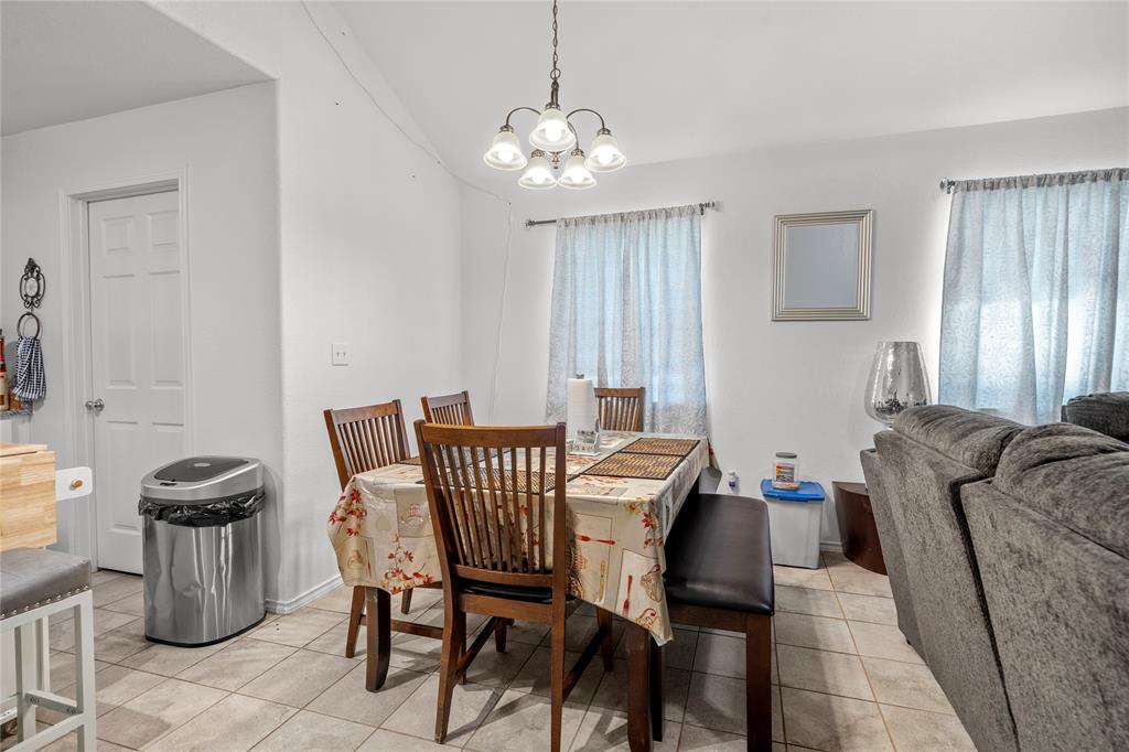420 Whitney Court Rio Vista, TX 76093 - Photo 7 of 25 a living room with furniture and a chandelier