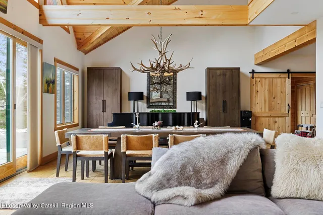 a kitchen with stainless steel appliances granite countertop a stove top oven a sink dishwasher and cabinets with wooden floor