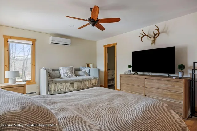 a view of a room with furniture and a window
