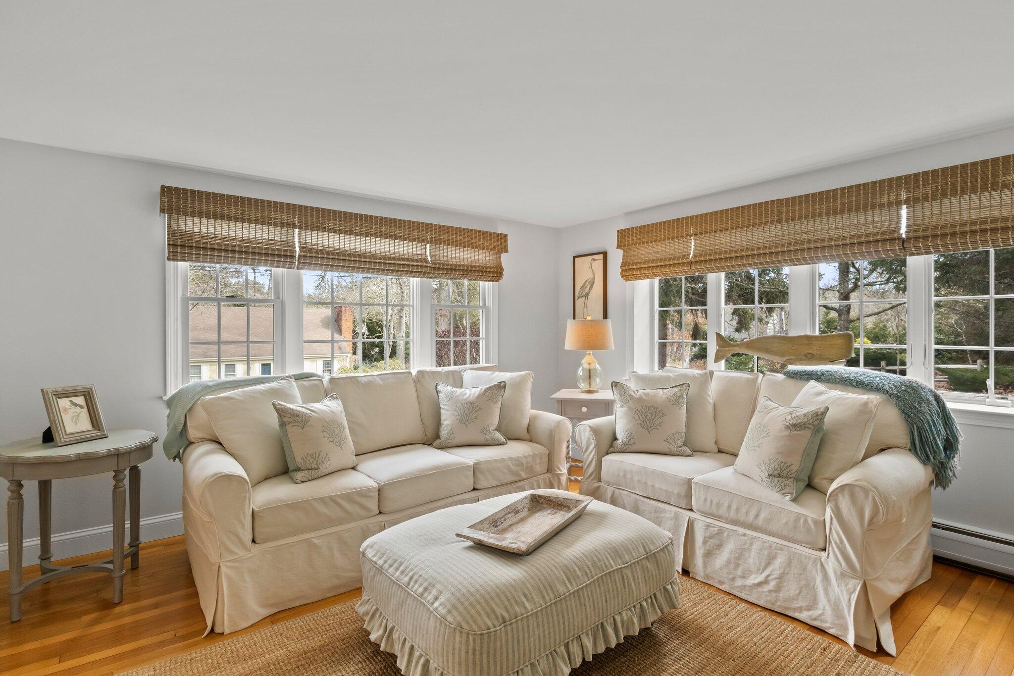 29 Jesse Eldredge Road Harwich, MA 02645 - Photo 14 of 56 a living room with furniture and a large window