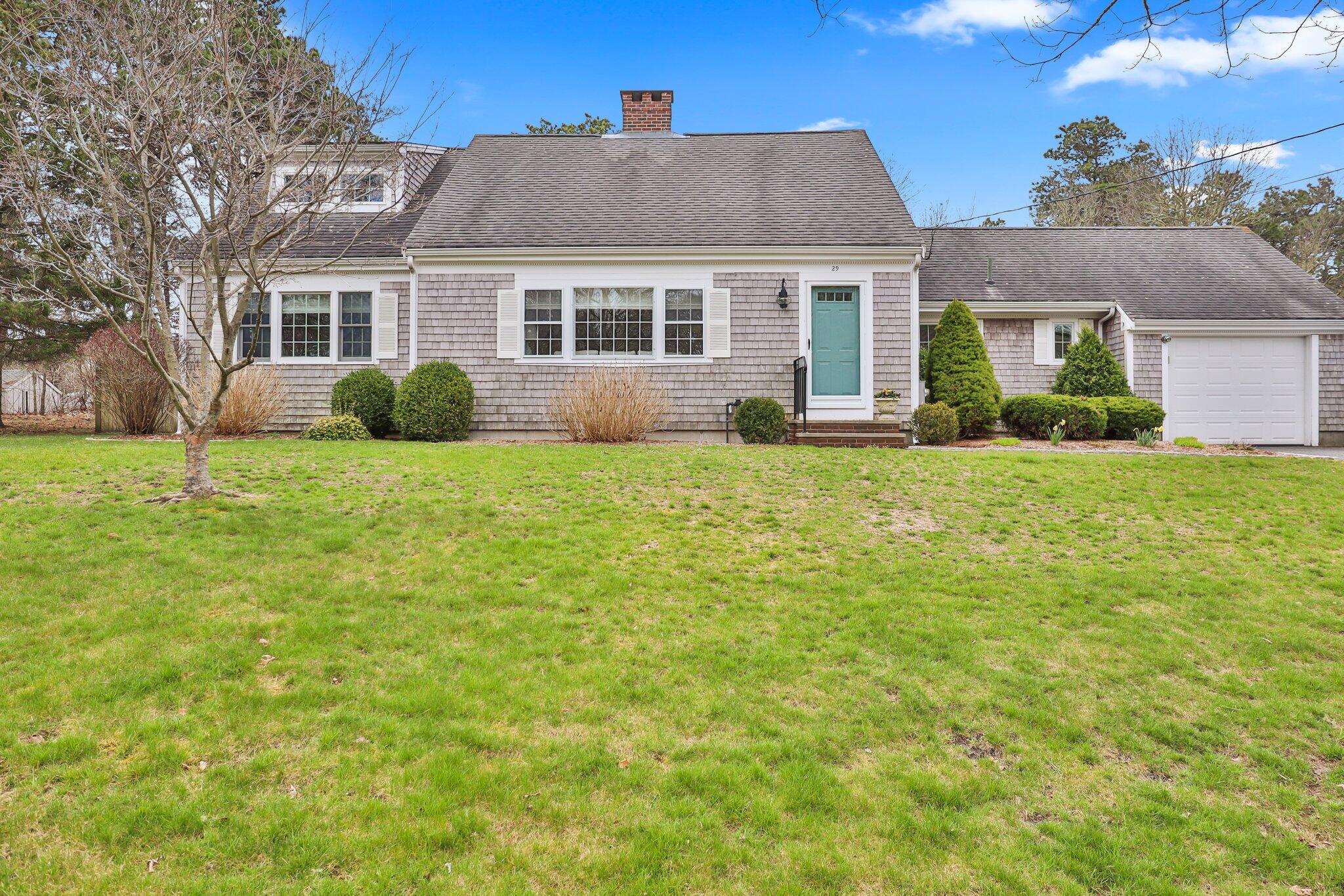 29 Jesse Eldredge Road Harwich, MA 02645 - Photo 2 of 56 a view of a house with a big yard