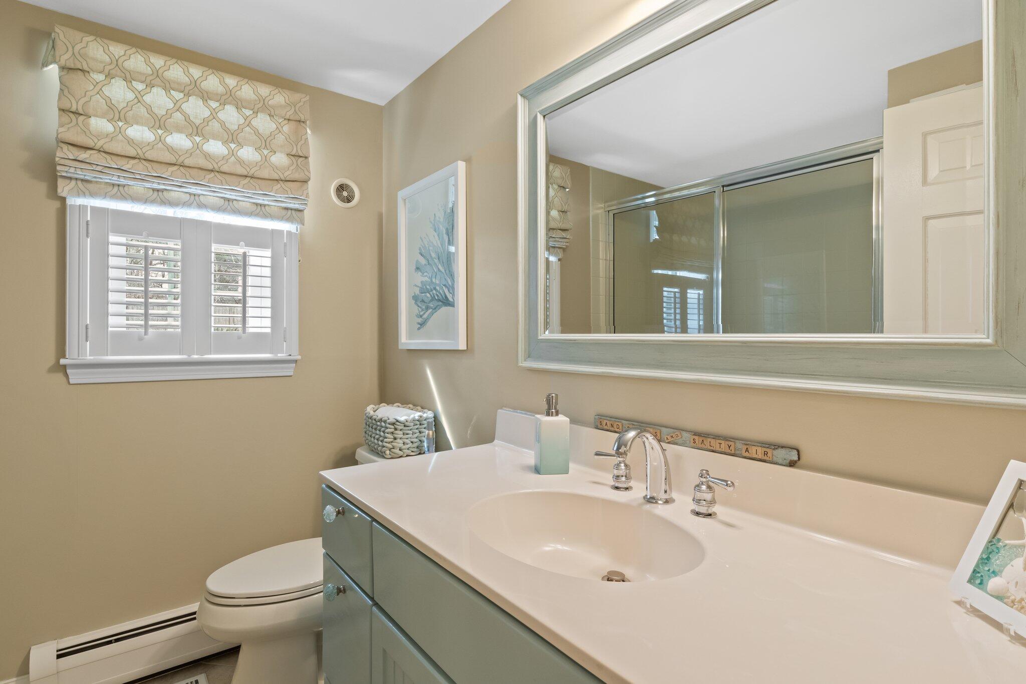 29 Jesse Eldredge Road Harwich, MA 02645 - Photo 21 of 56 a bathroom with a sink toilet and mirror