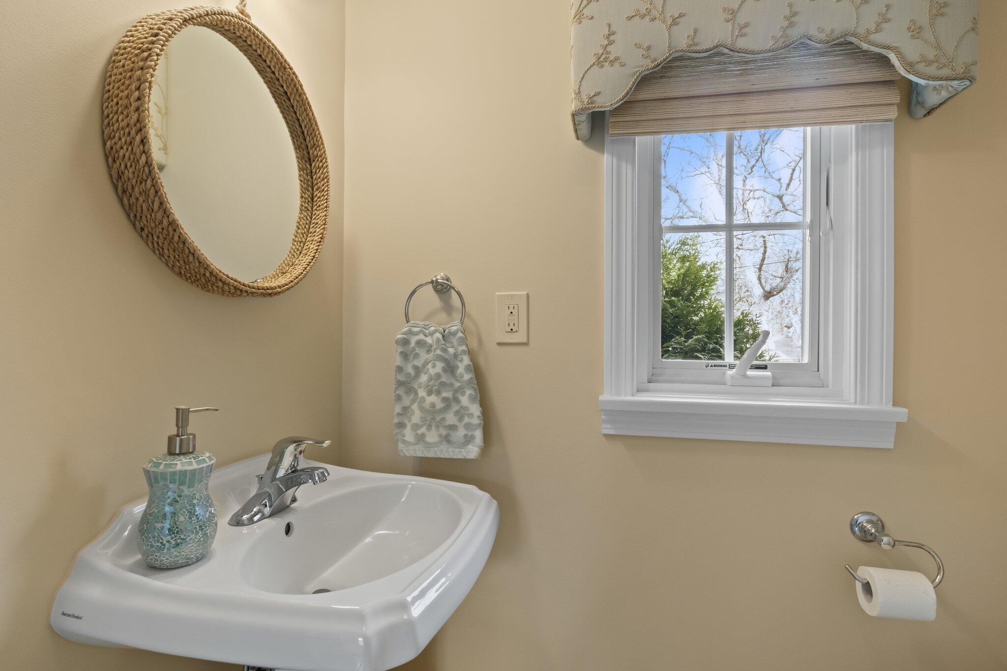 29 Jesse Eldredge Road Harwich, MA 02645 - Photo 31 of 56 a bathroom with a sink and a mirror