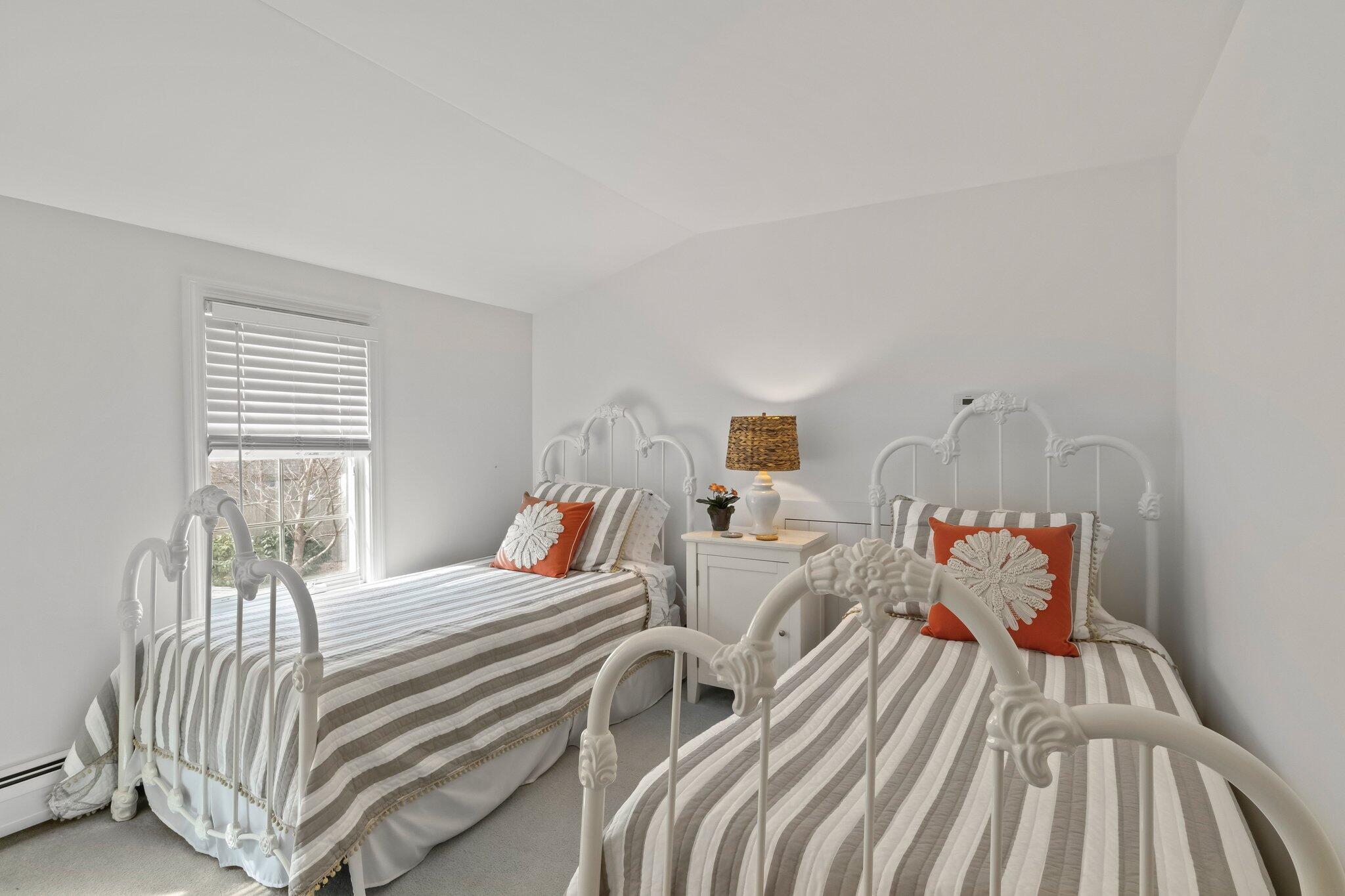 29 Jesse Eldredge Road Harwich, MA 02645 - Photo 32 of 56 a bedroom with a bed and wooden floor