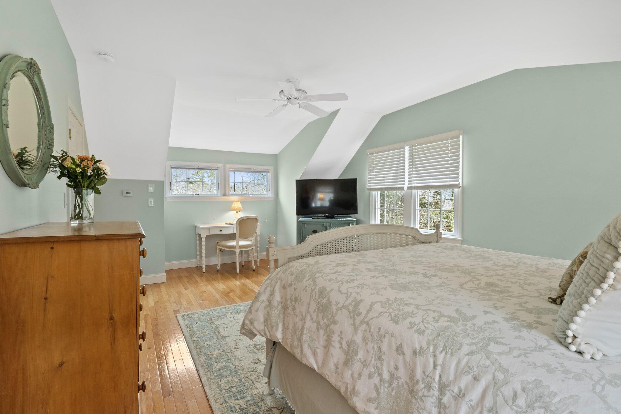 29 Jesse Eldredge Road Harwich, MA 02645 - Photo 40 of 56 a bedroom with a bed a window and a television