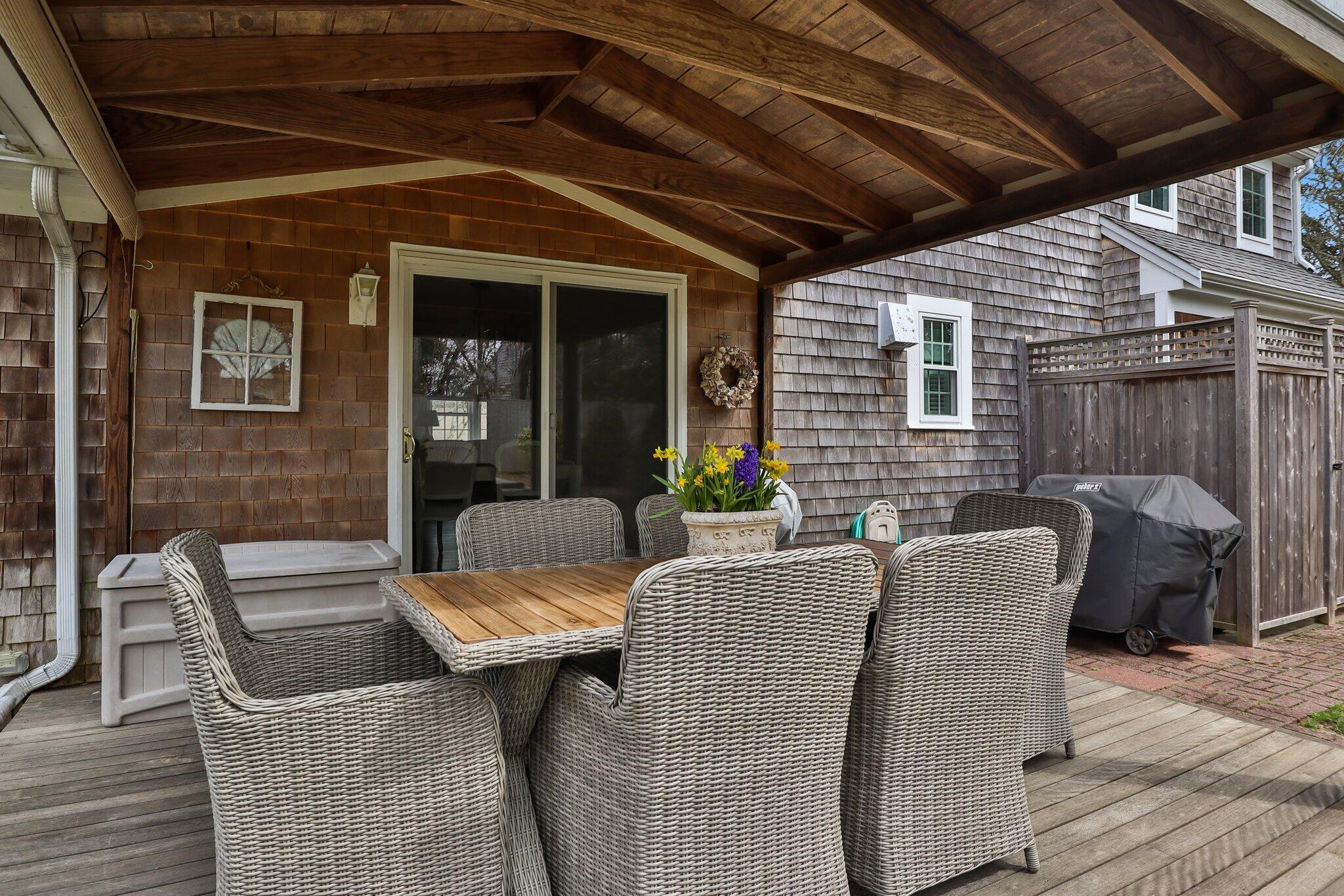 29 Jesse Eldredge Road Harwich, MA 02645 - Photo 45 of 56 a view of a patio with a table and chairs
