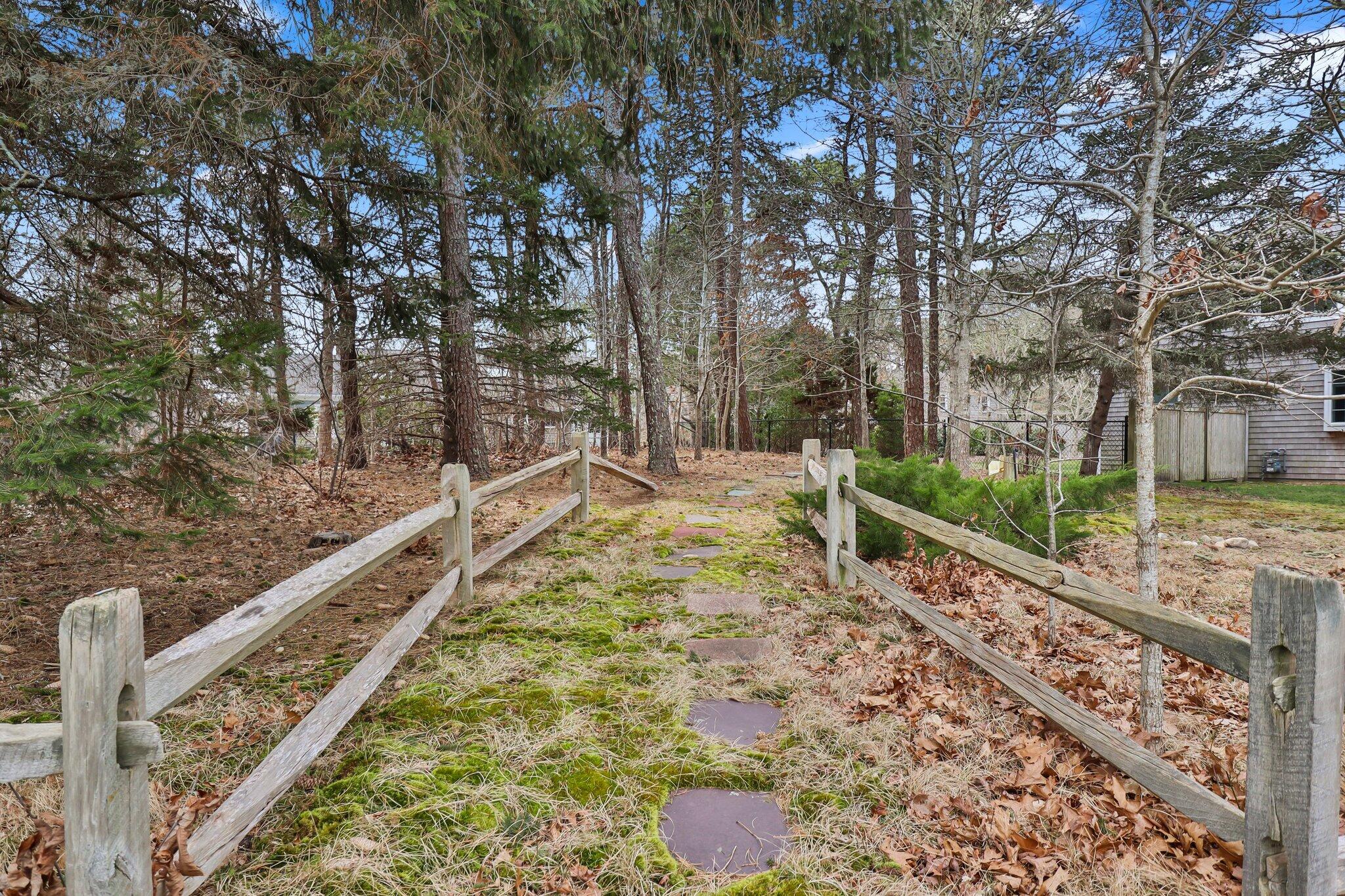 29 Jesse Eldredge Road Harwich, MA 02645 - Photo 54 of 56 a view of a yard with wooden fence