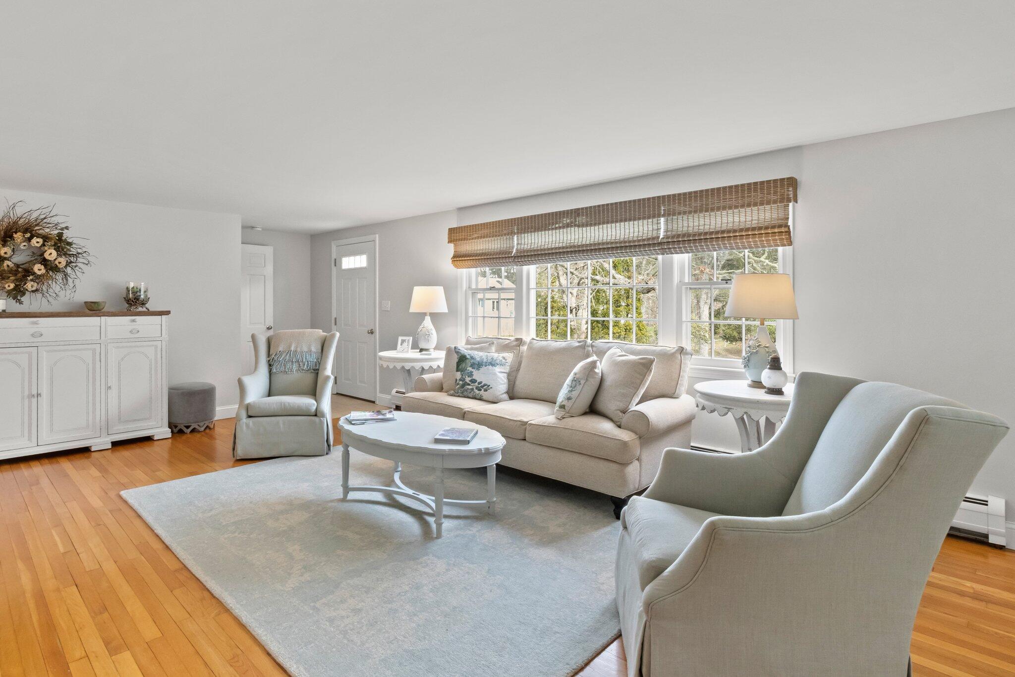 29 Jesse Eldredge Road Harwich, MA 02645 - Photo 8 of 56 a living room with furniture and a large window