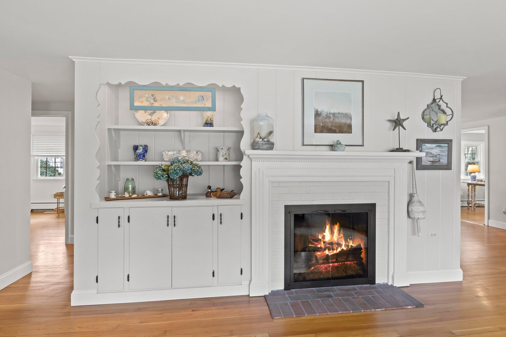 29 Jesse Eldredge Road Harwich, MA 02645 - Photo 10 of 56 a living room with furniture and a fireplace