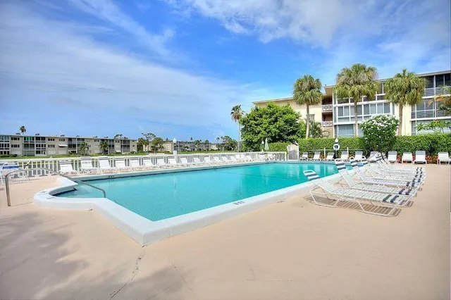 a room with pool tables and windows