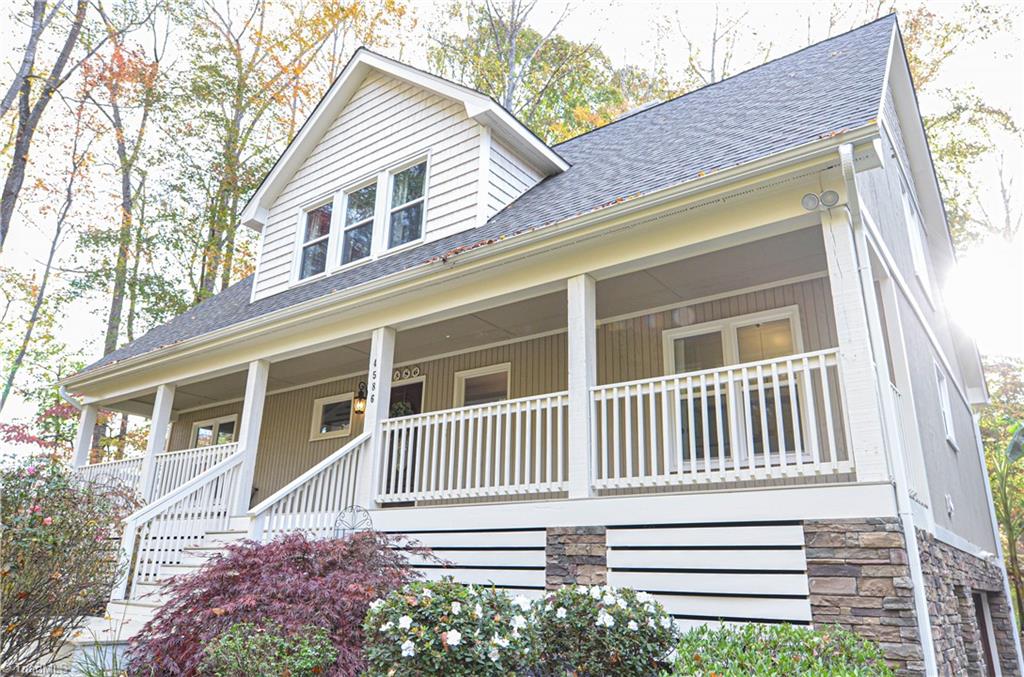 4586 Peeples Road Oak Ridge, NC 27310 - Photo 3 of 50 Enjoy the views on this spacious front porch.