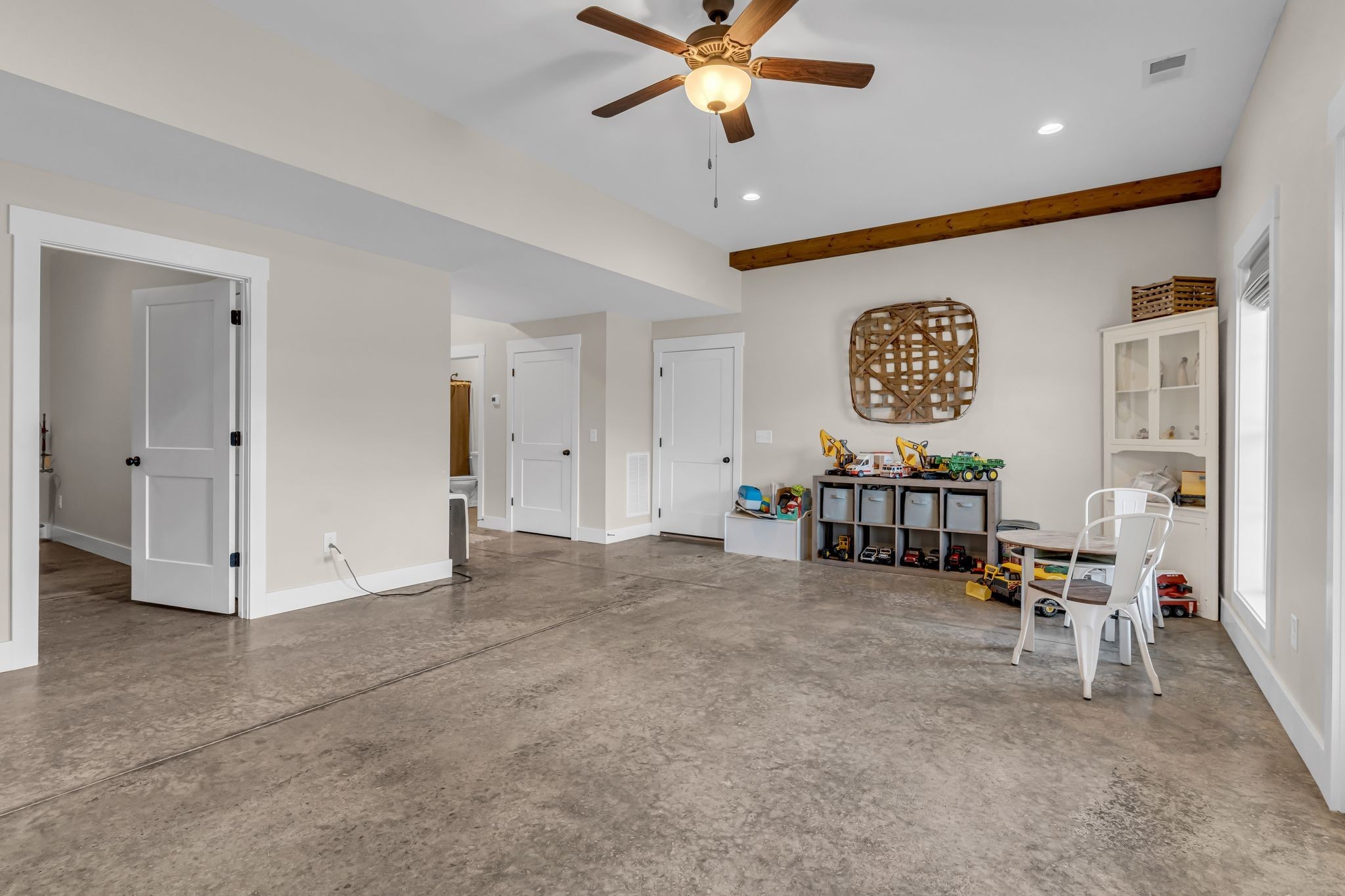 5574 Dowlen Road Cedar Hill, TN 37032 - Photo 40 of 59 a view of a livingroom with furniture and a ceiling fan