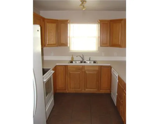 a utility room with sink dryer and washer