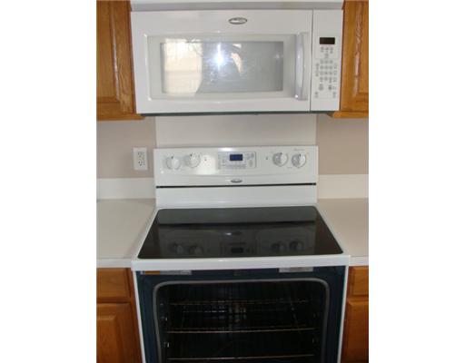 1214 Jonnell Street Corpus Christi, TX 78418 - Photo 6 of 10 a stove top oven sitting inside of a kitchen
