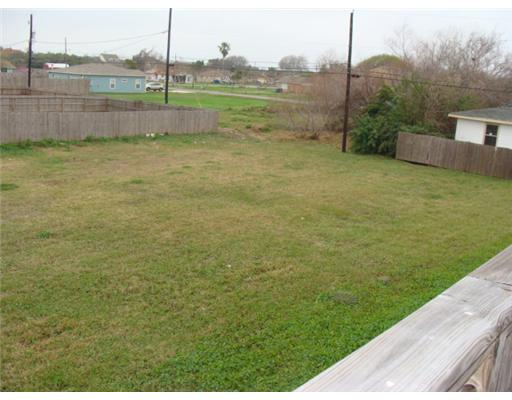 1214 Jonnell Street Corpus Christi, TX 78418 - Photo 9 of 10 a view of a field with a big yard