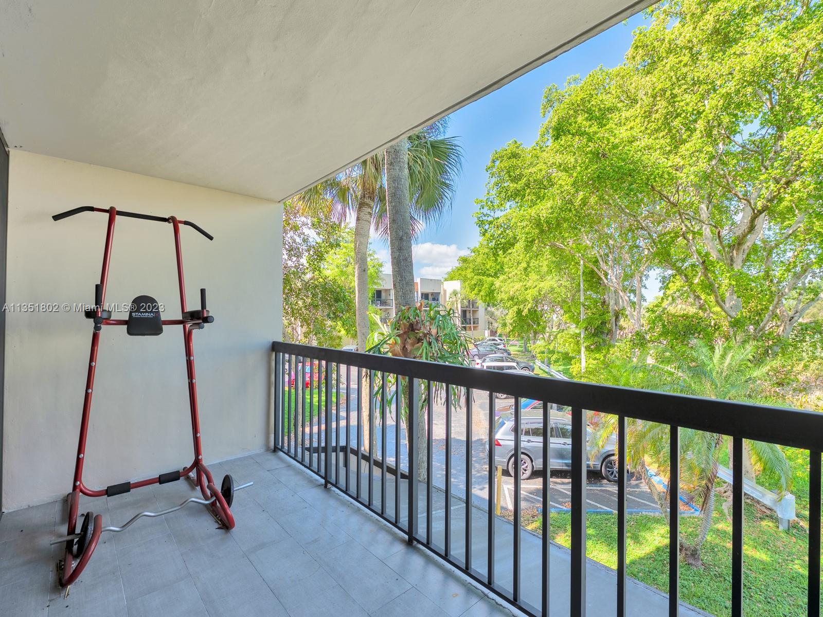 10865 Southwest 112th Avenue, Unit 209 Miami, FL 33176 - Photo 14 of 29 a view of a room with gym equipment