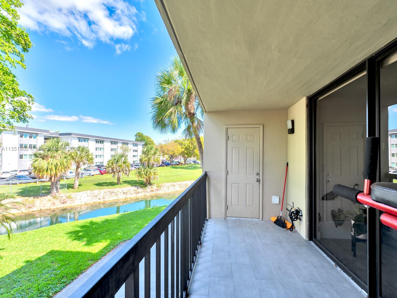 10865 Southwest 112th Avenue, Unit 209 Miami, FL 33176 - Photo 15 of 29 a view of a living room and garage