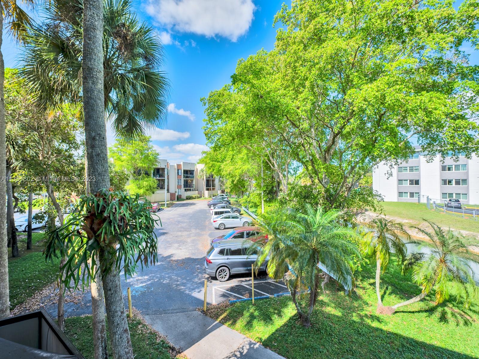 10865 Southwest 112th Avenue, Unit 209 Miami, FL 33176 - Photo 26 of 29 a front view of a house with garden