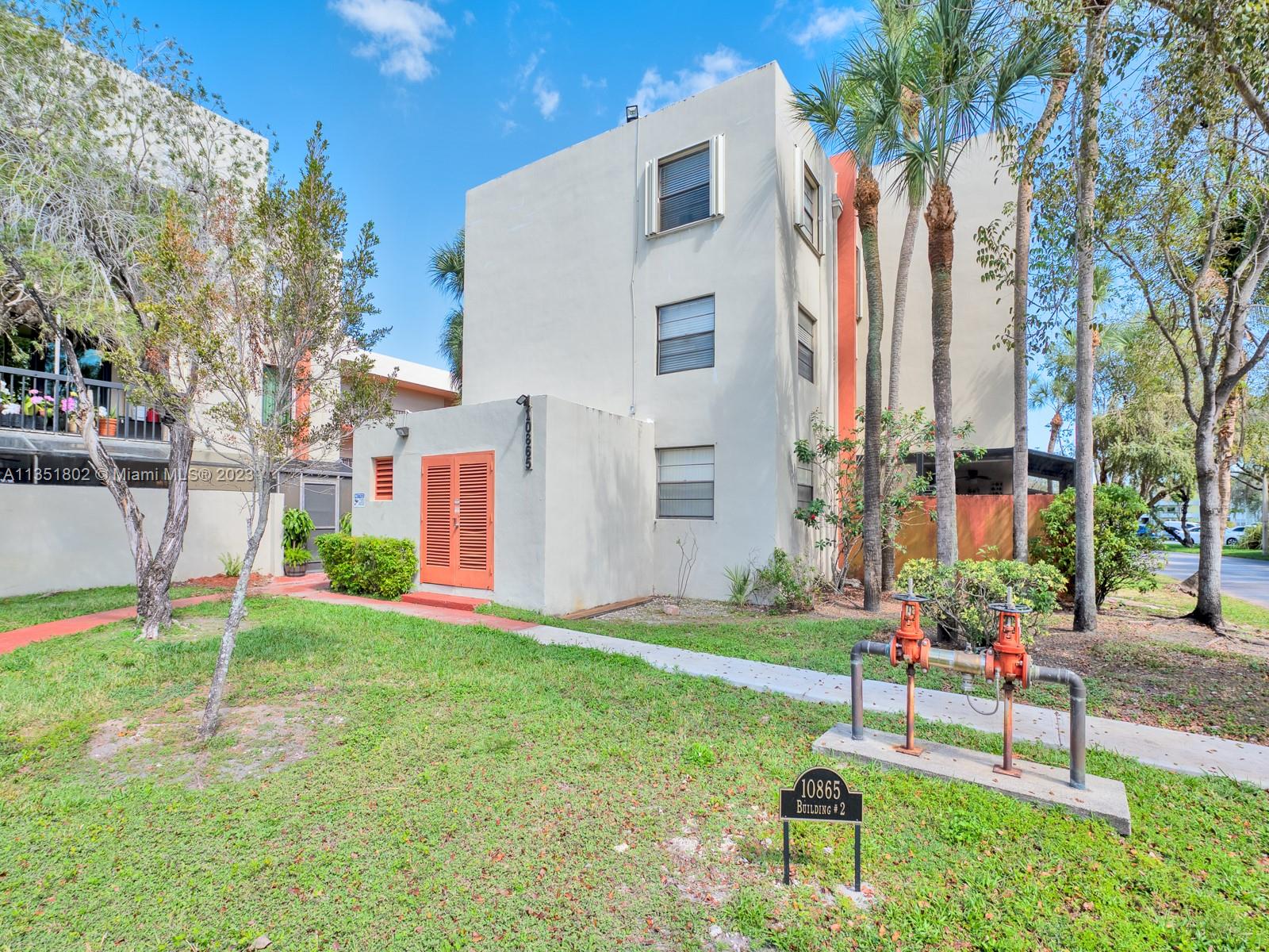 10865 Southwest 112th Avenue, Unit 209 Miami, FL 33176 - Photo 10 of 29 a house view with a garden space
