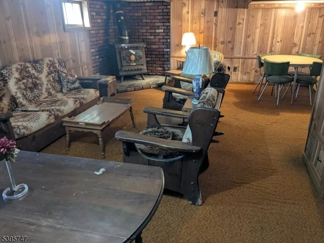 a living room with furniture and next to a window