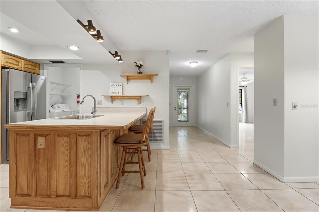 25 Jamaica Street Homosassa, FL 34446 - Photo 17 of 49 a dining hall with stainless steel appliances a sink and cabinets