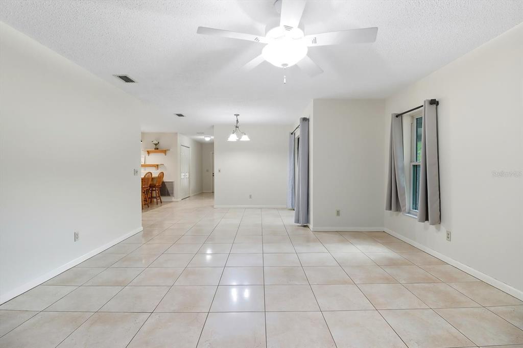 25 Jamaica Street Homosassa, FL 34446 - Photo 22 of 49 an empty room with a ceiling fan and a window