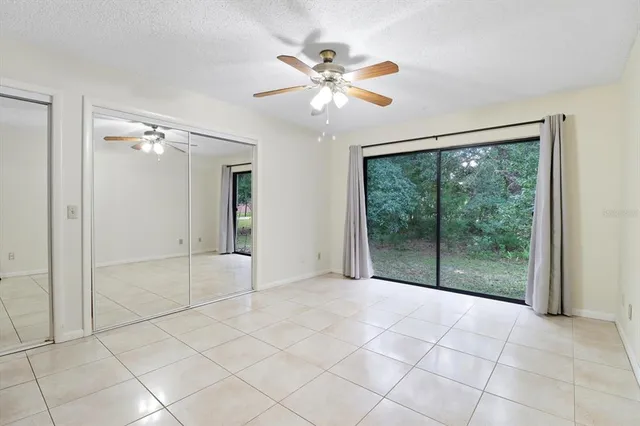 a view of an empty room with glass door