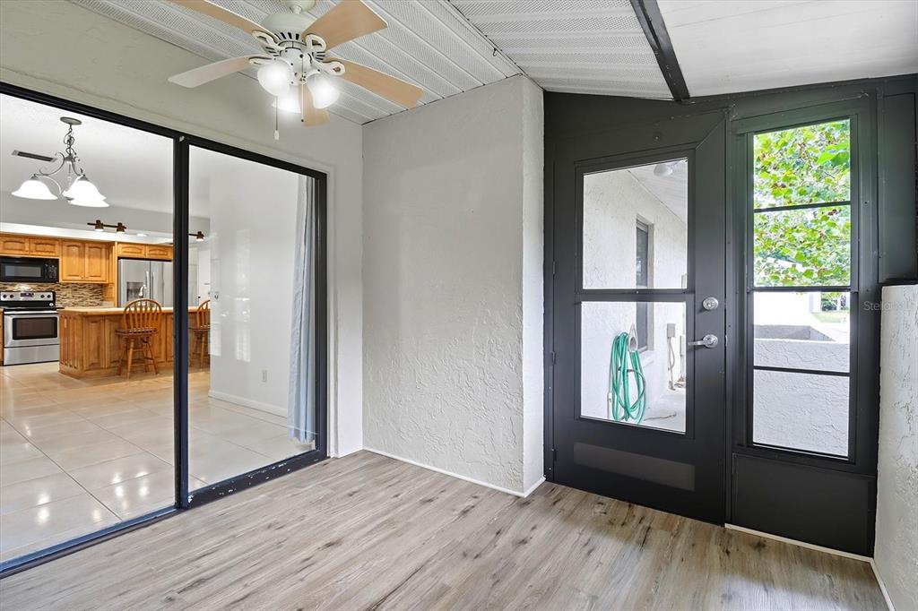 25 Jamaica Street Homosassa, FL 34446 - Photo 38 of 49 a view of an empty room with wooden floor and a window