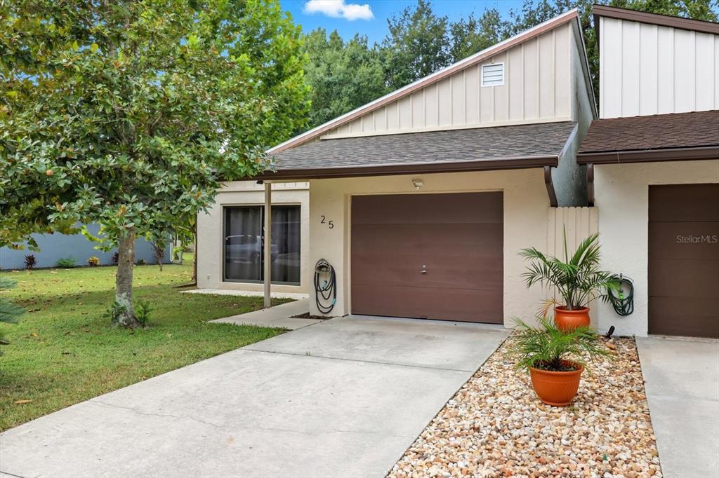 25 Jamaica Street Homosassa, FL 34446 - Photo 5 of 49 a front view of a house with garden