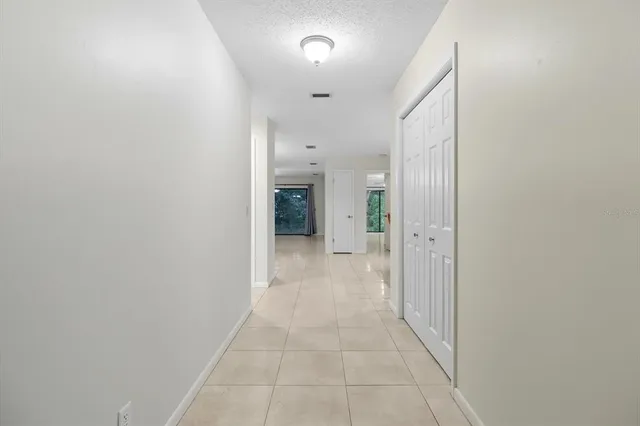 a view of a hallway with a bathroom